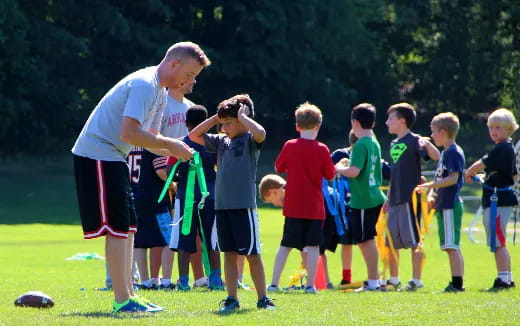 a person holding a rope with a group of kids
