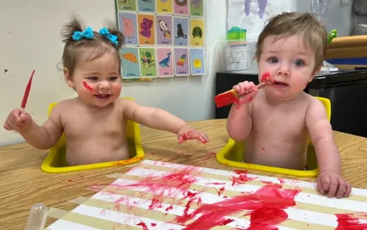 two kids sitting at a table