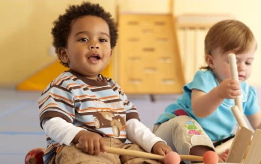 a couple of kids playing with sticks