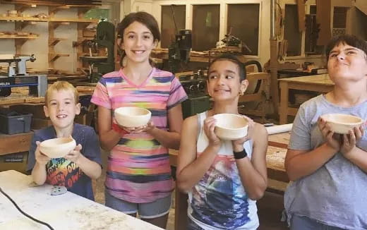 a group of people holding cups