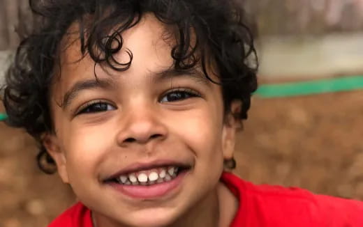 a close-up of a girl smiling