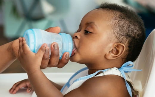a baby drinking from a bottle
