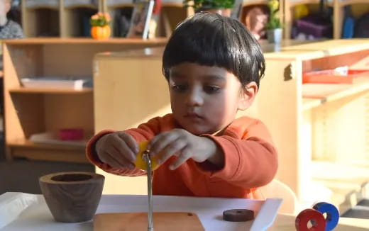 a child sitting at a table