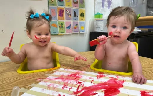 two kids in a yellow tub