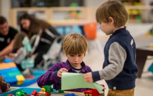 a couple of kids playing with toys