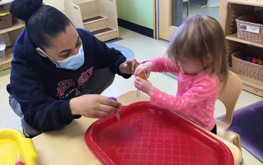 a person and a child painting