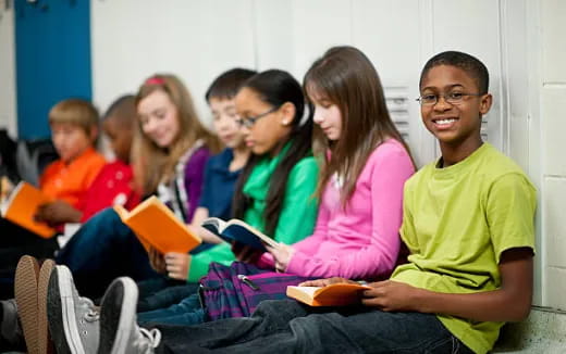 a group of students sitting in a classroom