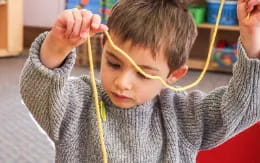 a young boy wearing a headset