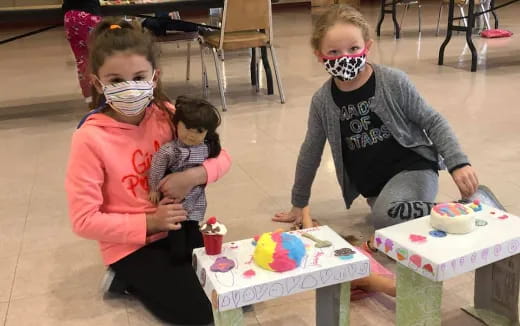 a group of children wearing masks