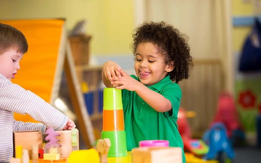 a young boy playing with toys