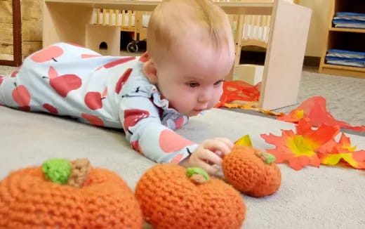 a baby playing with toys