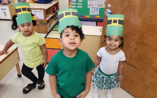 a group of children wearing party hats