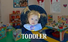 a child sitting in a high chair