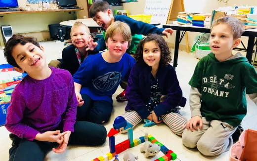 a group of children sitting on the floor