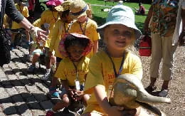 a group of children in yellow shirts