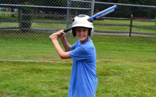 a girl holding a baseball bat