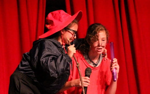 a man and woman singing into microphones