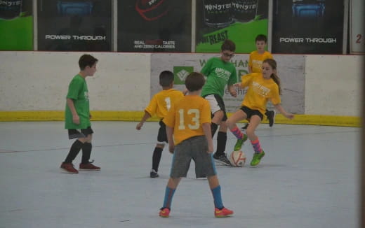 a group of kids playing a sport