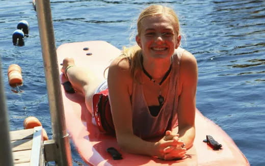 a person in a garment on a boat