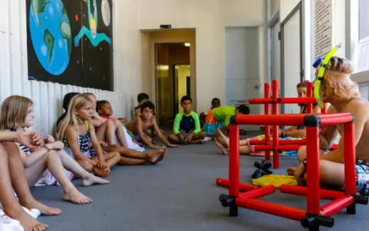 a group of children sitting on the floor
