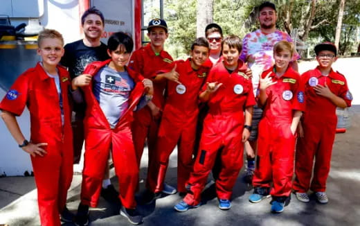a group of people wearing matching outfits