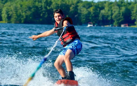 a man and woman water skiing