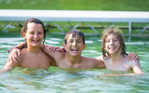 a group of children in a pool