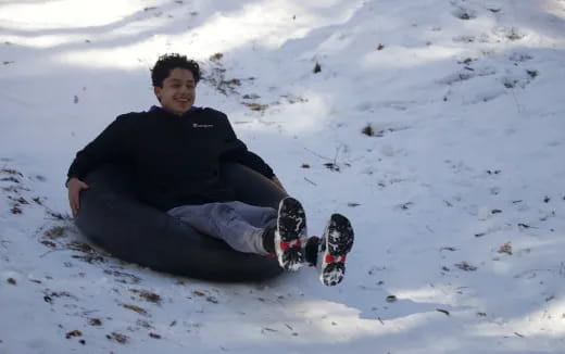 a man sitting in the snow