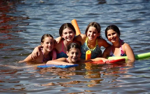 a group of girls in the water