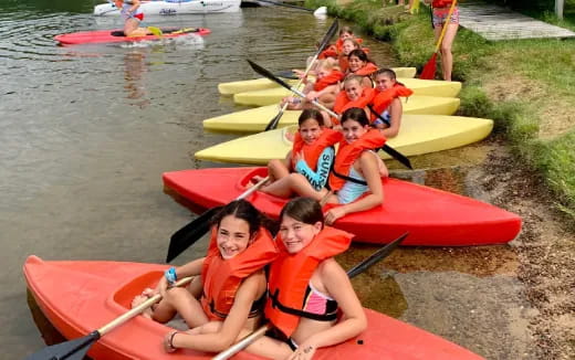 a group of people in kayaks