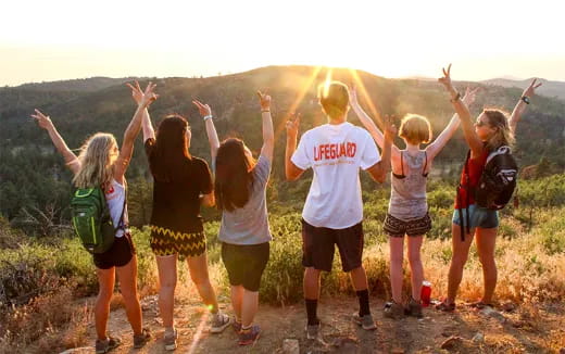 a group of people jumping in the air