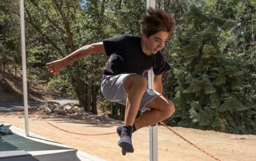 a person jumping over a hurdle