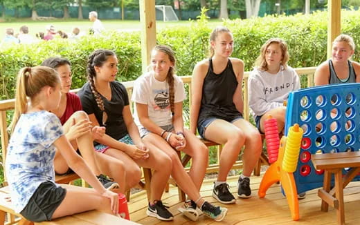 a group of women sitting on chairs