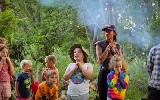 a group of children standing outside