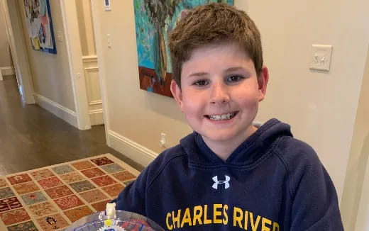 a boy smiling for the camera
