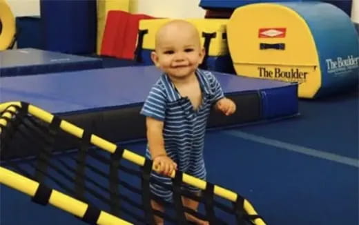 a baby holding a toy