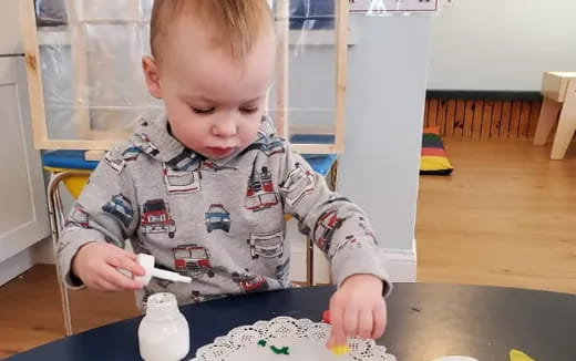 a baby playing with a toy