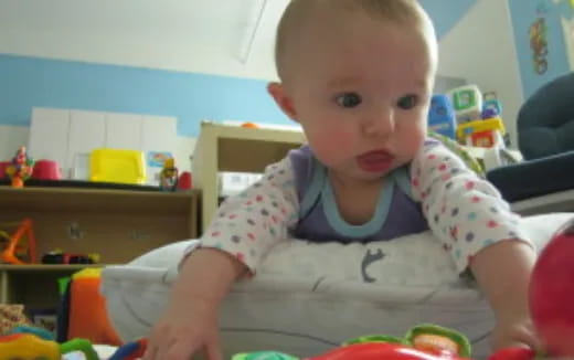 a baby sitting on a chair