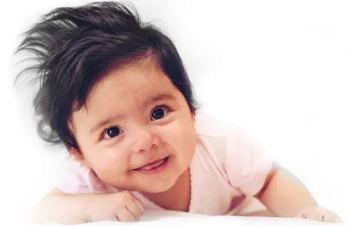 a baby with a big smile