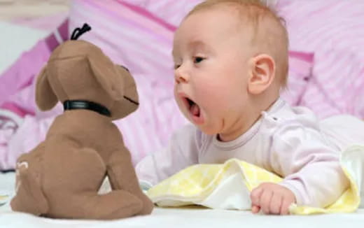 a baby with a stuffed animal