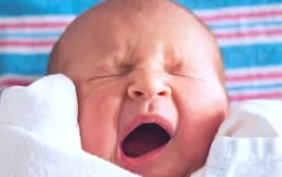 a baby with its mouth open
