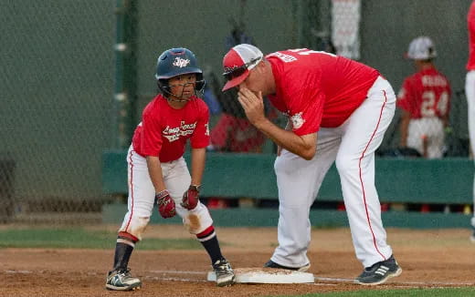 a baseball player is trying to tag the catcher