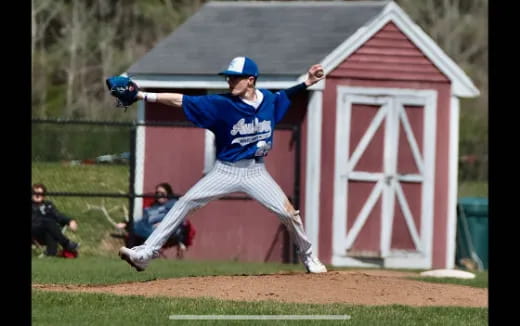 a baseball player throwing a ball