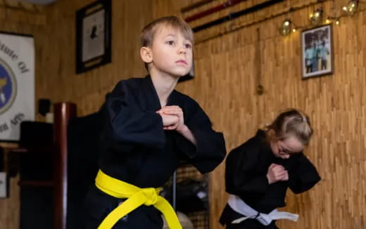 a boy in a black robe