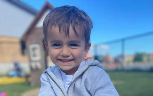 a boy smiling for the camera
