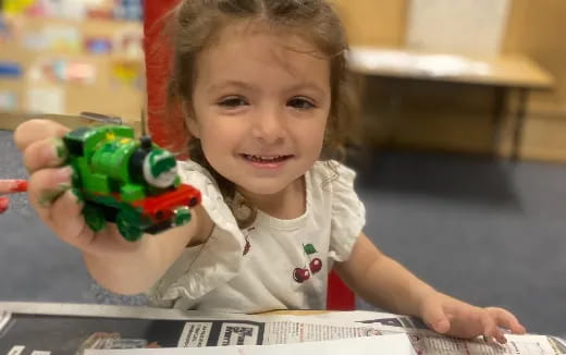 a child holding a toy
