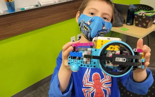 a child holding a toy gun