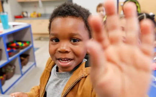 a child with his hands up