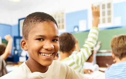 a close-up of a boy smiling