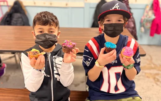 a couple of boys holding ice cream cones